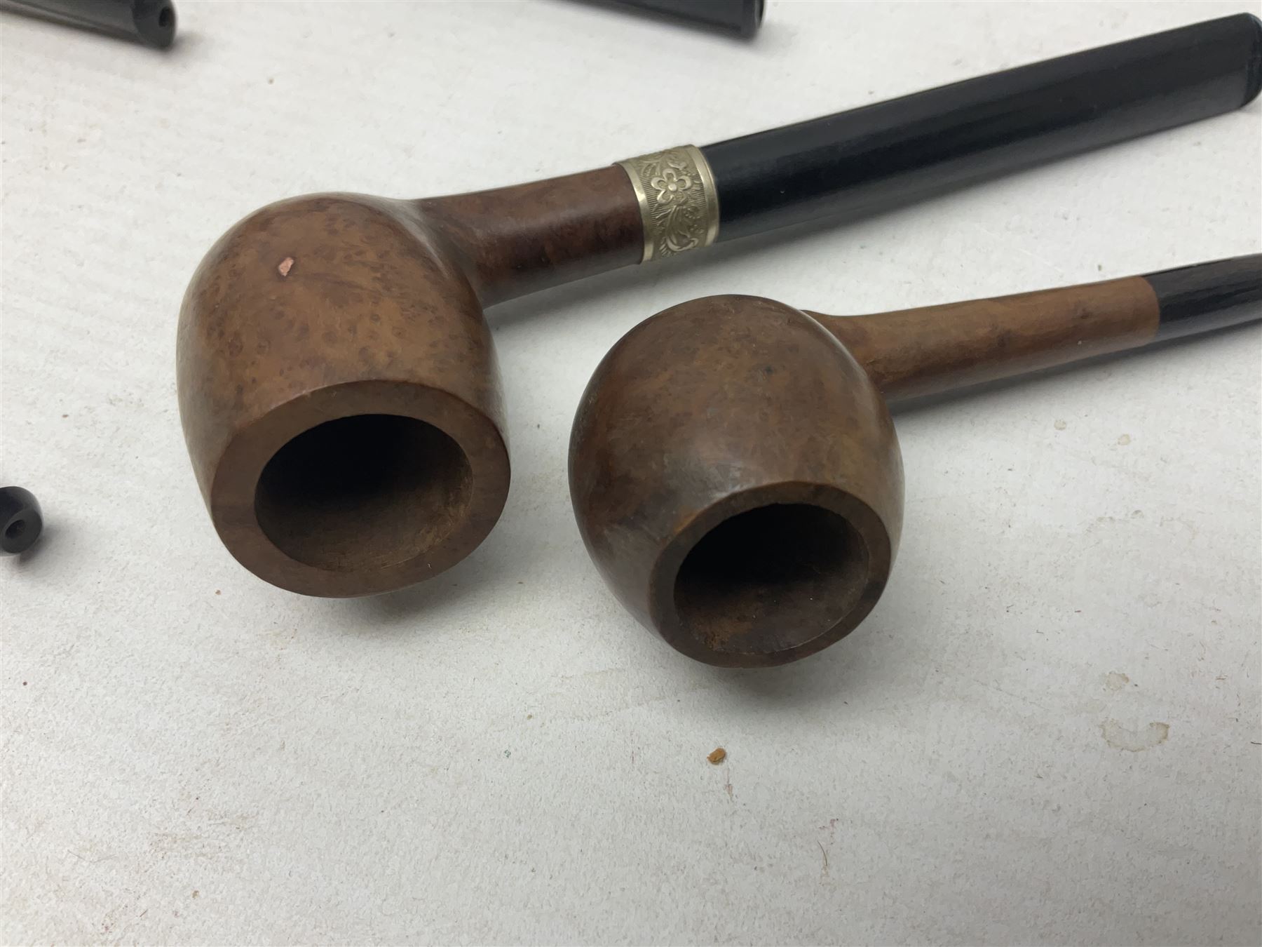 Collection of eight silver mounted pipes, comprising a briar wood Imperial ITC example with silver collar hallmarked A.W Birmingham 1903, horn handled example with silver collar hallmarked LB, probably Louis Blumfeld, Birmingham 1900, three examples marked B.W, one marked Globe A.O.C, Blumfeld's Best Briar pipe marked BBB and Riseagle example, together with two further pipes (10)