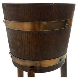 RA Lister & Co, Dursley - early 20th century oak jardinière plant stand, coopered barrel on three splayed supports united by undertier 