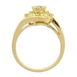 18ct gold diamond crossover ring, the central round brilliant cut diamond of approx 0.45 carat, with round brilliant and tapered baguette cut diamond surround, total diamond weight approx 1.00 carat
