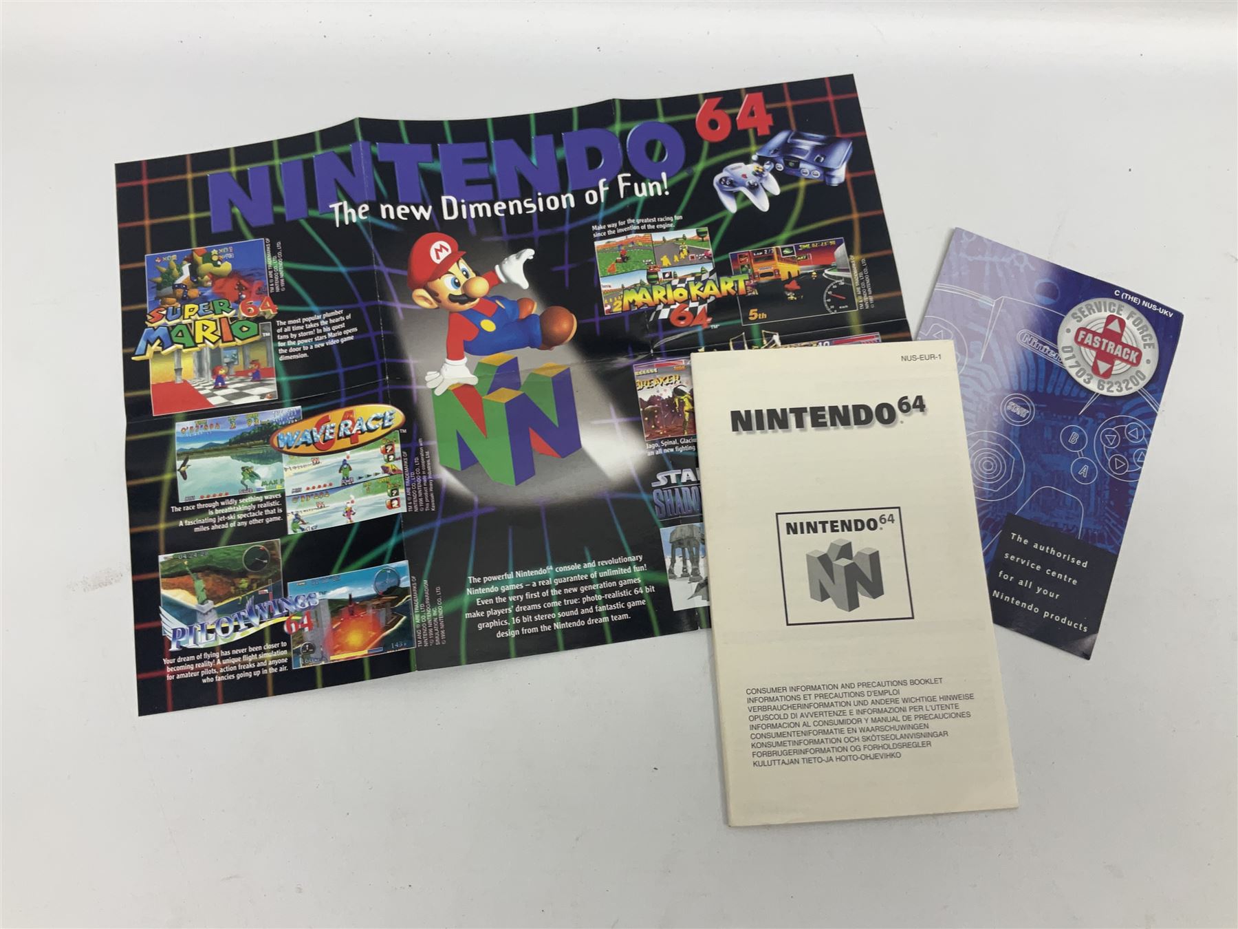 Nintendo 64 console, two controllers, games and accessories. Accessories to include the ‘Tremorpak’ and ‘Spook’ 2 Phono plugs and a S-VHS plug with adapter, both in original boxes. Games to include ‘Golden Eye 007’, ‘Doom 64’, ‘Killer Instinct Gold’, ‘Tetrisphere’, ‘F-1 World Grand Prix’, ‘Pilotwings 64’ and ‘Lylatwars’ with ‘Rumble Pak’, all with original boxes and instruction manuals. ‘Star Wars Episode I Racer’ game cartridge in Shadows of the Empire box. 