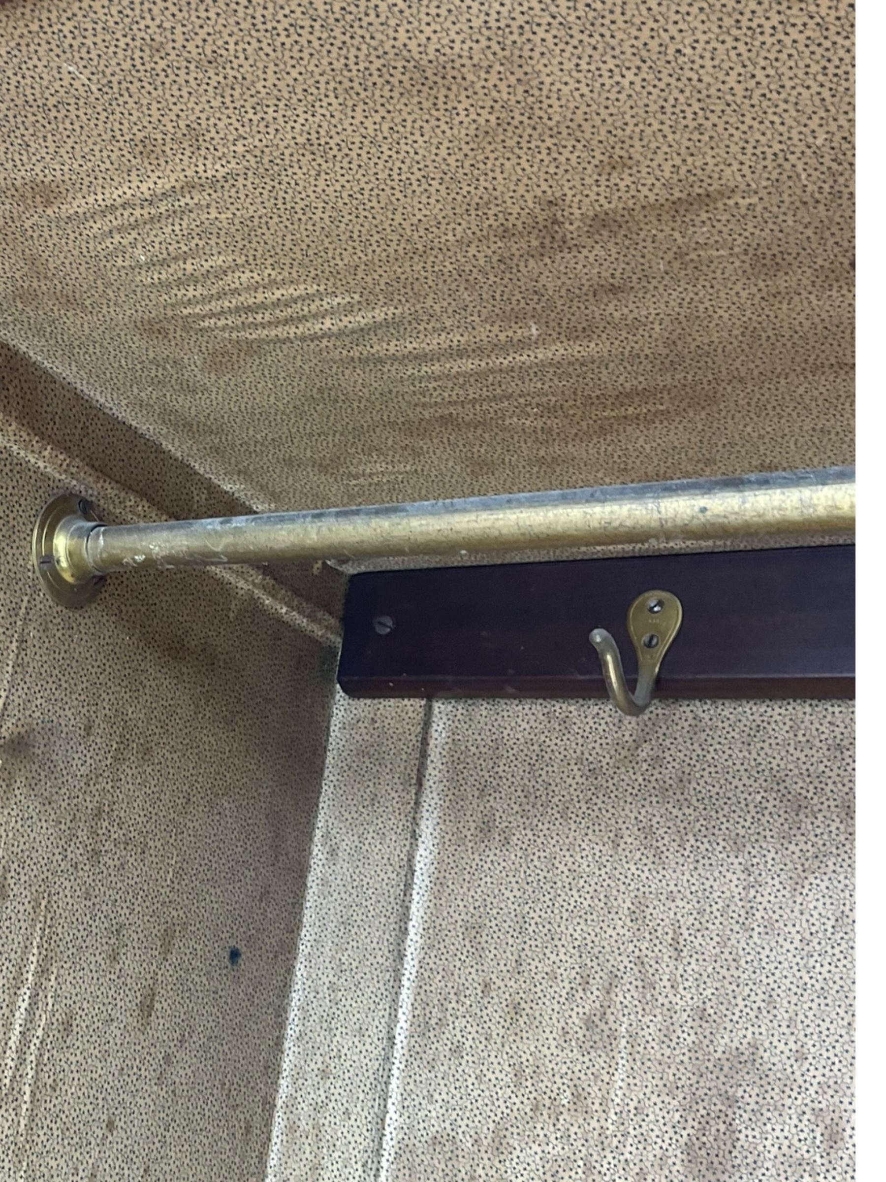 Late Victorian walnut triple combination wardrobe, projecting moulded and dentil cornice, central shaped bevelled mirror glazed door, cartouche and curled leaf carved panels over figured walnut veneered panels, fitted with drawer to base, on bracket feet