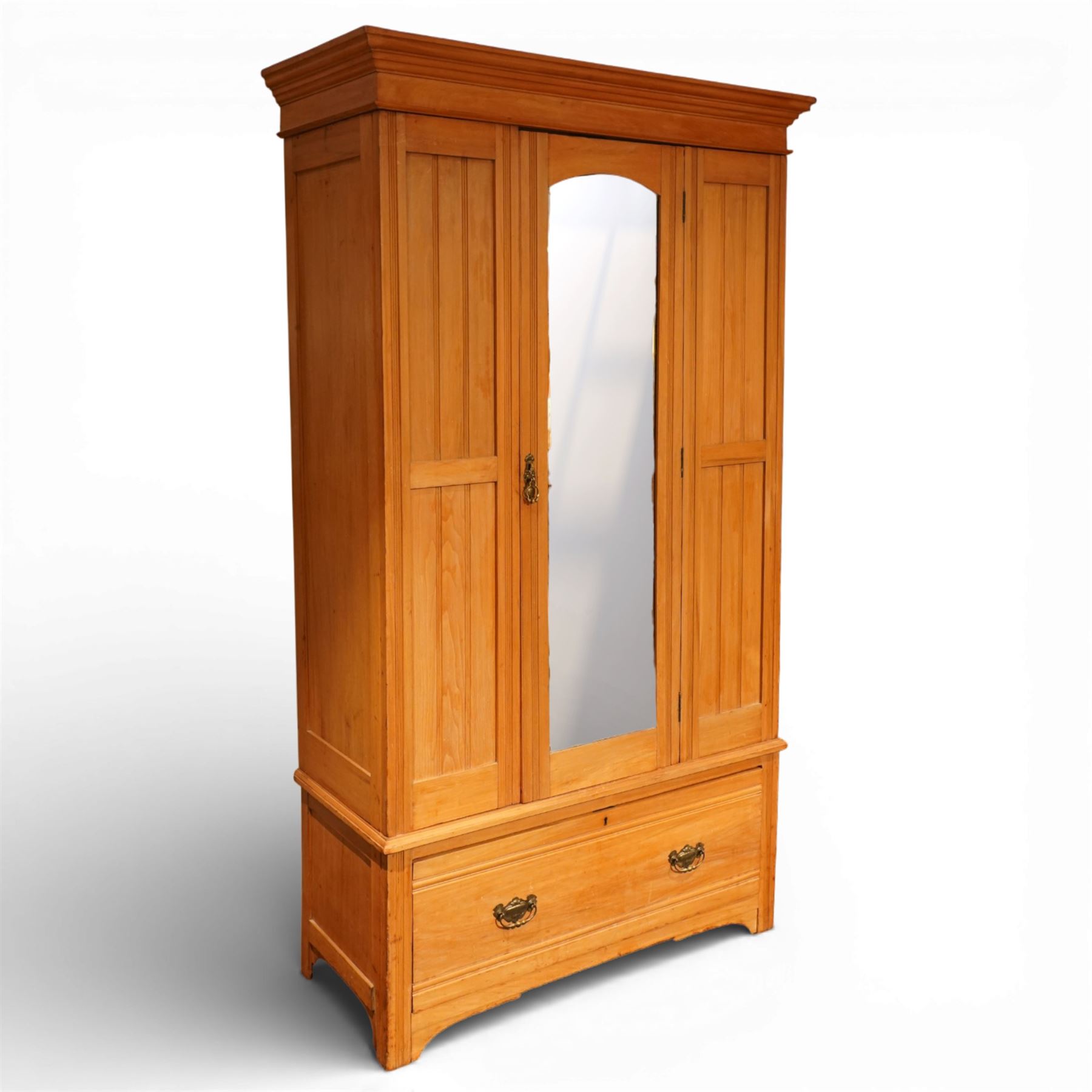 Edwardian ash single wardrobe, the moulded cornice above a single mirrored  hanging interior, flanked by panelled sections with drawer below, raised on bracket feet
