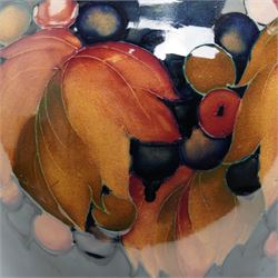 William Moorcroft vase decorated in the leaves and berries pattern, signed to base H21cm 