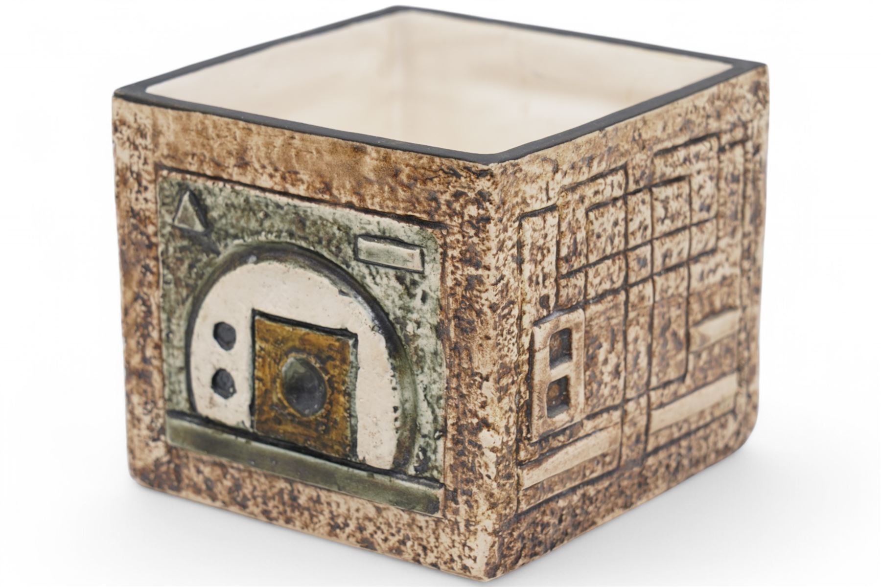 Troika cube vase, with incised geometric decoration in green and cream on a mottled light brown ground, signed to base with initials for artist Shirley Wharf, H8.5cm