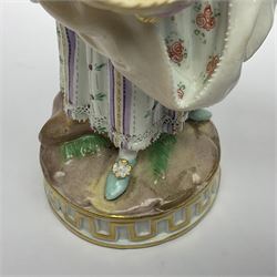 Pair of late 19th/early 20th Century Meissen figures, modelled as flower sellers, after the original by Michel Victor Acier, she holding basket of flowers, he holding flowers in his hat, each with underglaze cross swords mark beneath, tallest H16.5cm