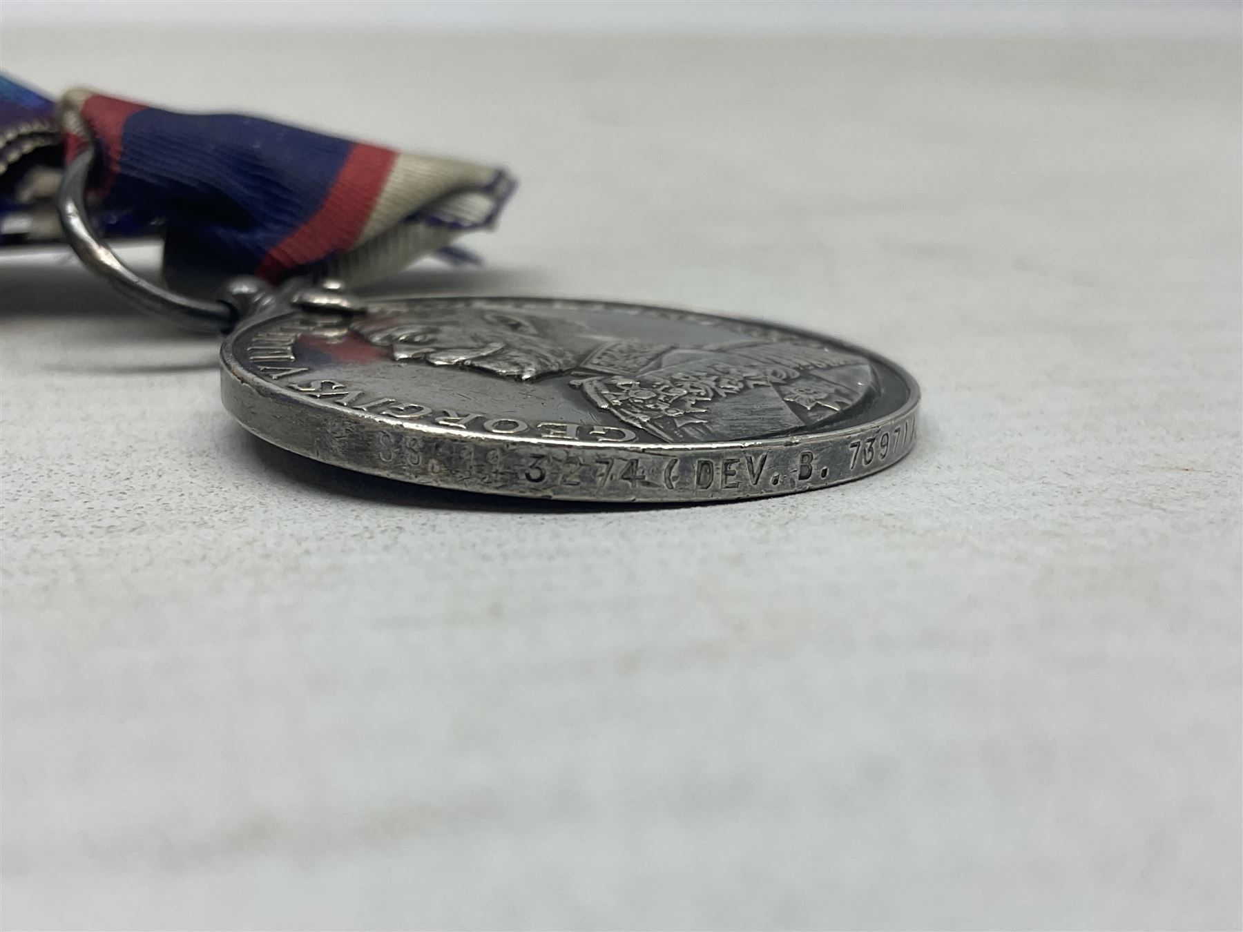 WW1 British Royal Navy Campaign and Royal Naval Fleet Reserve Long Service and Good Conduct group of five medals comprising British War Medal, 1914-15 Star and Victory Medal awarded to SS.113274 J.W. Baines Sto.1 R.N.; Naval general Service Medal to J.W. Baines Sto.1 N.B.; and Royal Fleet Reserve Long Service and Good Conduct Medal to SS.113274 (Dev. B.7397) J.W. Baines Sto.1 R.F.R.; all with ribbons