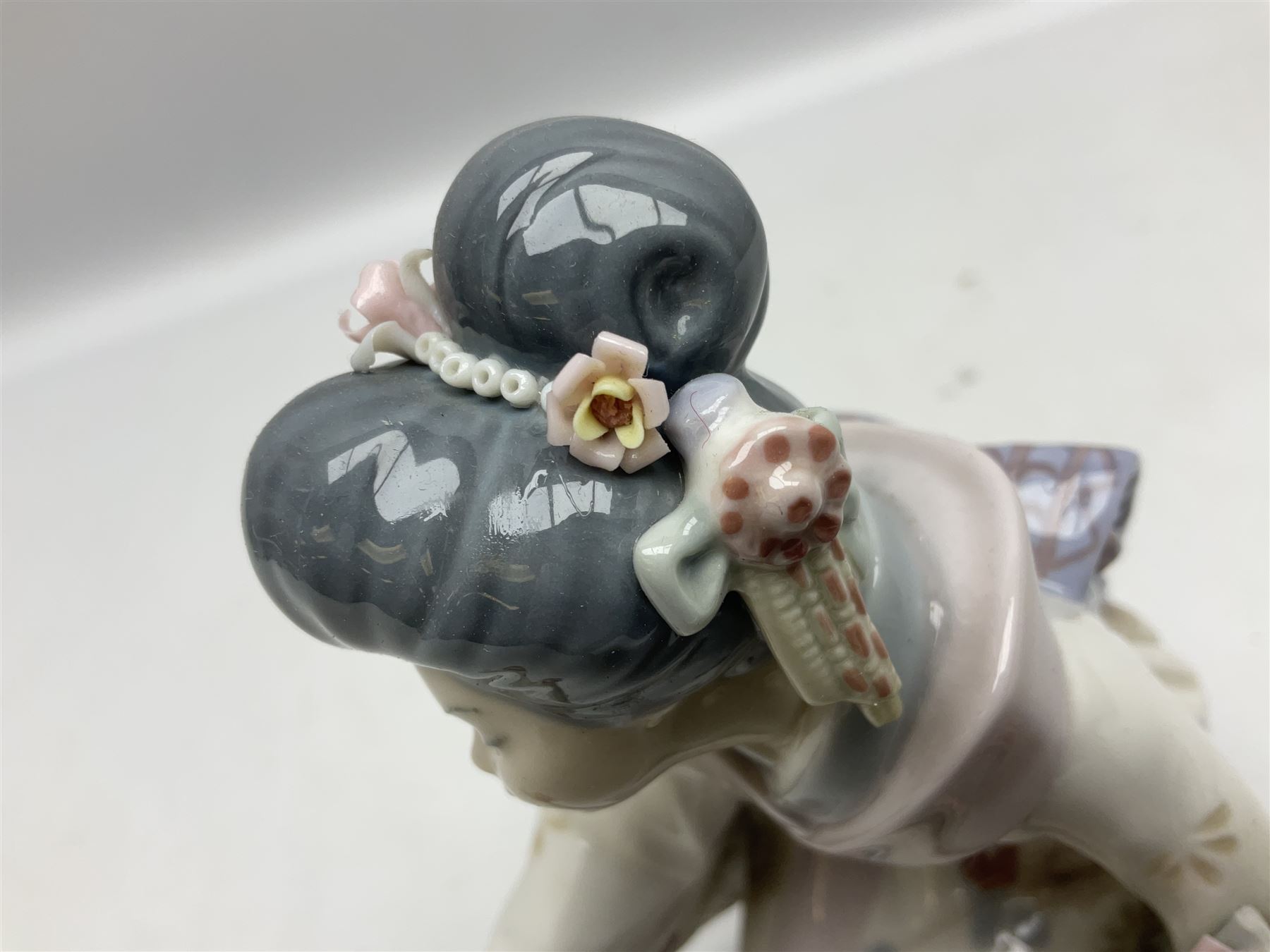 Two Lladro Japanese Ladies figures, comprising Kiyoko no 1450 and Yuki no 1448, both issued 1983, retired 1998, largest example H20cm