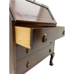 Early 20th century oak fall front bureau, fitted with three drawers, on angular cabriole supports