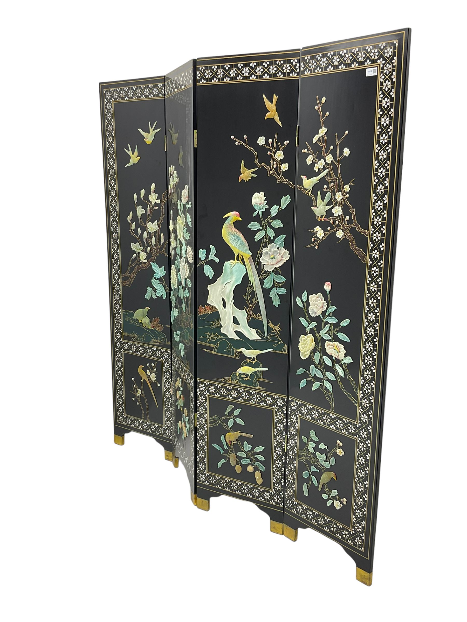 Japanese Shibayama style black lacquered four panel folding screen, naturalist scenes of trailing branch and blossom flowers, decorated with with birds, floral mother of pearl inlaid borders