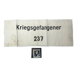 German POW armband printed in black 'Kriegsgefangener 237' on a white ground; and an 'SS' Reinhard Heydrich mint postage stamp (2)