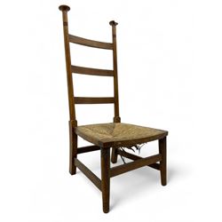 Attributed to William Birch of High Wycombe - Arts & Crafts oak ladder-back side chair, with turned finials, rush seat, and stretchers, raised on square-section supports; 19th century mahogany Pembroke table, rectangular drop-leaf top raised on turned supports with central stretcher and splayed feet