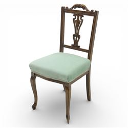 Late Victorian mahogany side chair, the carved cresting rail above a pierced and carved splat with lyre-form detail, the back panel inset with cane work, drop-in upholstered seat in pale green fabric with braid trim, raised on cabriole supports