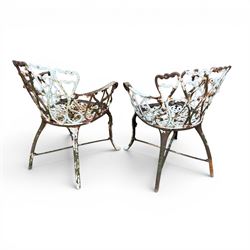 Pair of late 19th century painted cast iron garden chairs, open scroll and heart backs, ornate circular seat, raised on cabriole legs with X stretcher