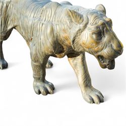 Pair of Chinese cast bronze tiger figures, one in a seated resting pose and the other advancing with open mouth, both with incised striping and aged bronze patina
Seated tiger (H 54cm, W 63cm, L 129cm)
Stood tiger (H 76cm, W 40cm, L 176cm) 