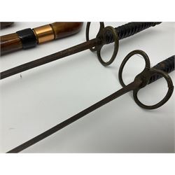 Leather covered swagger/sword stick with 40cm steel blade L62cm overall; another ash sword stick with 30cm diamond section steel blade; pair of fencing foils, the blades marked Solingen; two reproduction flintlock pistols; and 92cm inert cartridge belt (7)