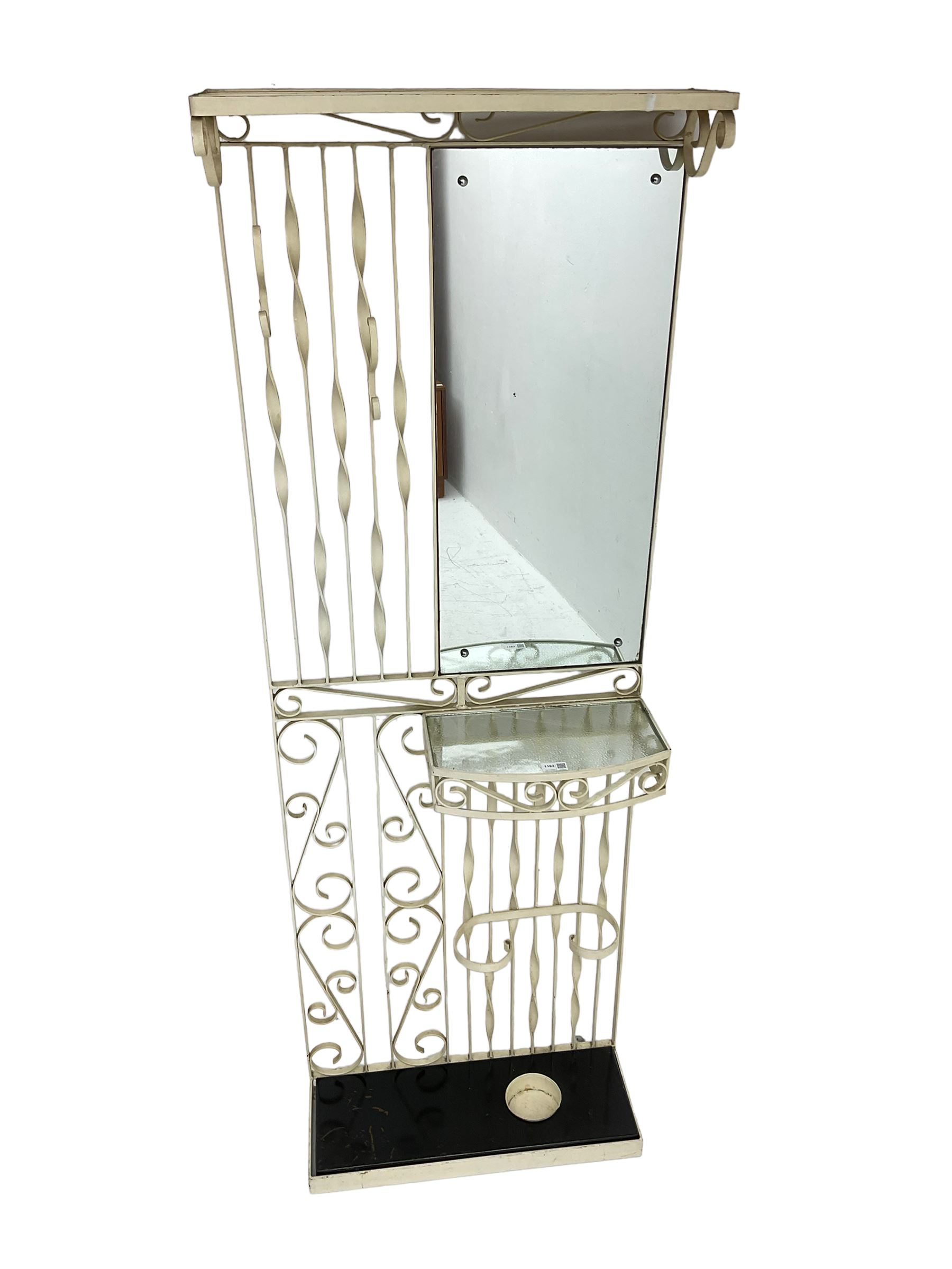 Cream painted scroll work wrought metal hall stand, fitted with mirror, shelf and stick stand