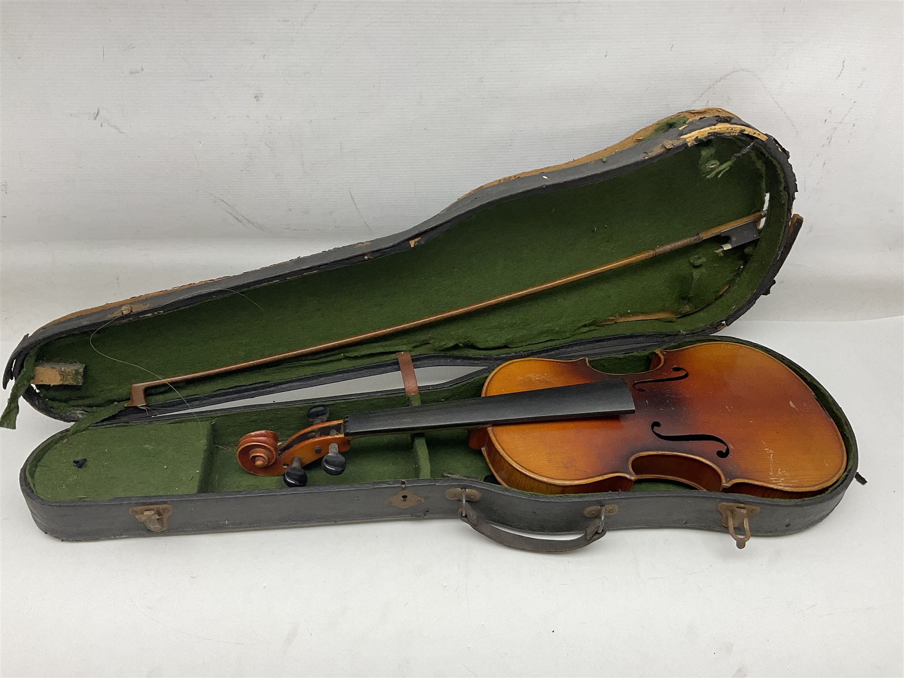 Czechoslovakian violin c1920 with 36cm two-piece maple back and ribs and spruce top, bears label 'Copy of Antonius Stradivarius Made in Czechoslovakia' L59cm; in carrying case; 1950s Czechoslovakian violin; and 195os Czechoslovakian three-quarter size violin; both cased (3)