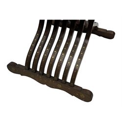 Late 20th century brass inlaid hardwood throne chair, curved X-frame form, raised shaped back inlaid with trailing leafy branches and flower heads, on sledge feet 