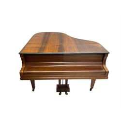  Antonin Petrof - Walnut overstrung baby grand piano, 7 0catve 85 key compass with original strings, tuning pins, damper felts and hammer heads, with roller keyboard action and iron frame, sustaining and una-corda pedals, sliding open lattice music desk, supported on square tapering legs with brass cups and castors, with inner ebonised key fall and ivorine label inscribed 'Supplied by Harrods, London'.