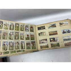 Three albums of cigarette cards including Wills Recruiting Posters, Military Motors and Allied Army Leaders, cricketers etc; another album containing a large quantity of laid-in cigarette cards; and an album of thirty-seven postcards of dogs by Mac (5)