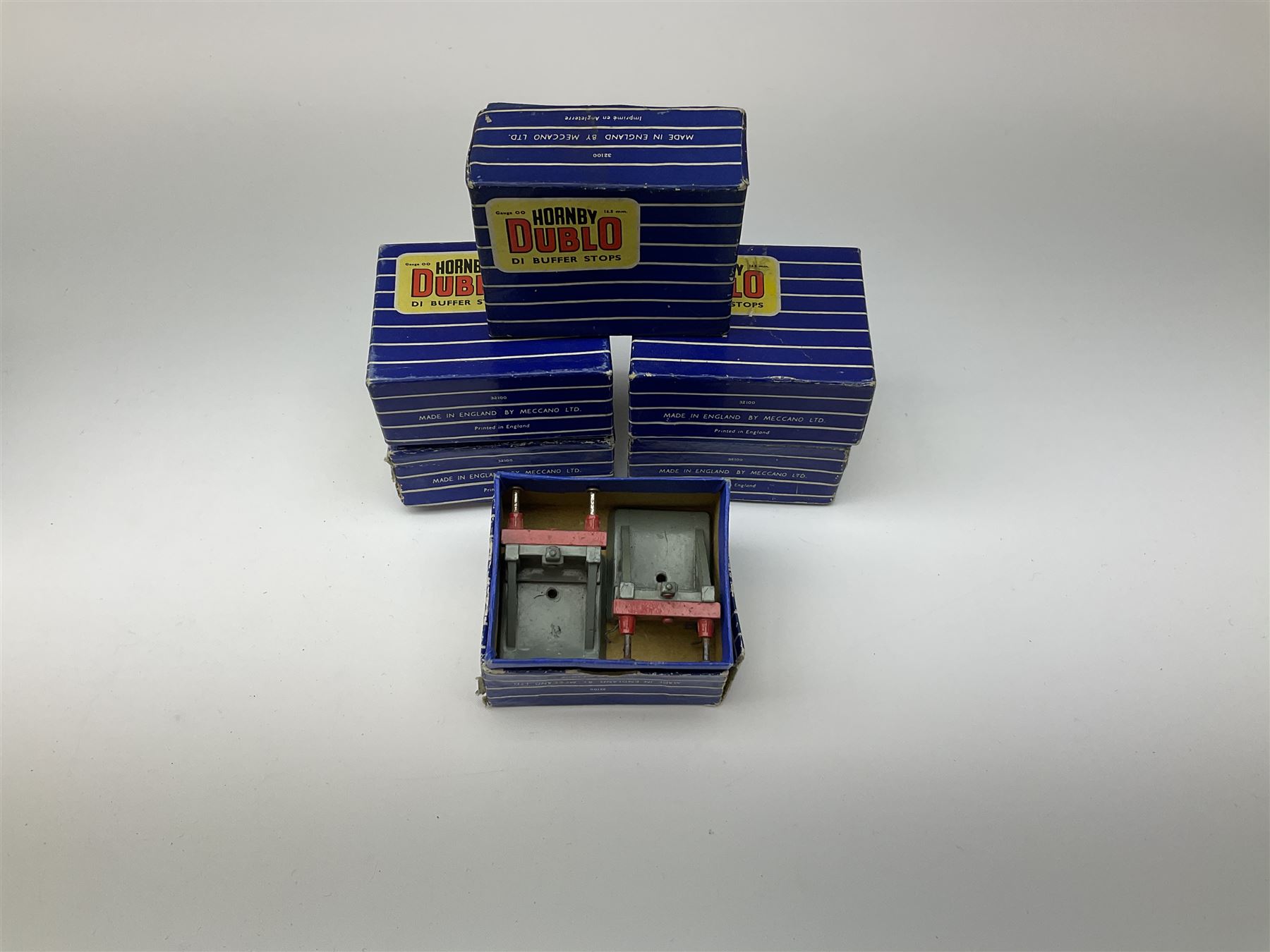 Hornby Dublo - twenty-three pairs of buffer stops including three pairs of 2451 Illuminated for two-rail track; five pairs of 3450 for three-rail track only; and fifteen D1 pairs; all boxed; and two odd loose buffers (21)