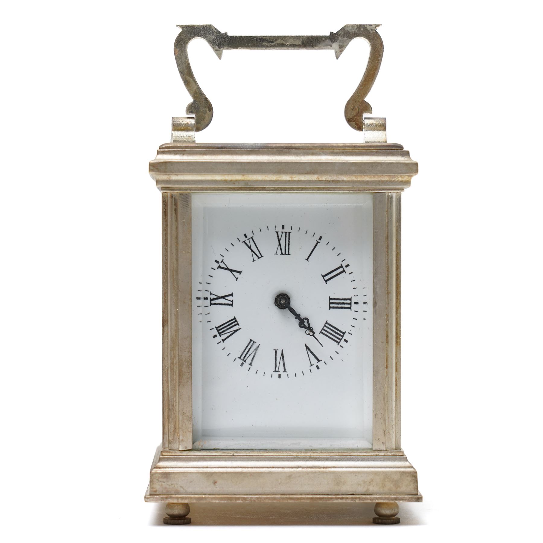20th century- Silver plated miniature carriage clock in an anglaise case with an enamel dial, Roman numerals, minute track and pieced steel hands, with an oval viewing glass to the lever platform escapement.