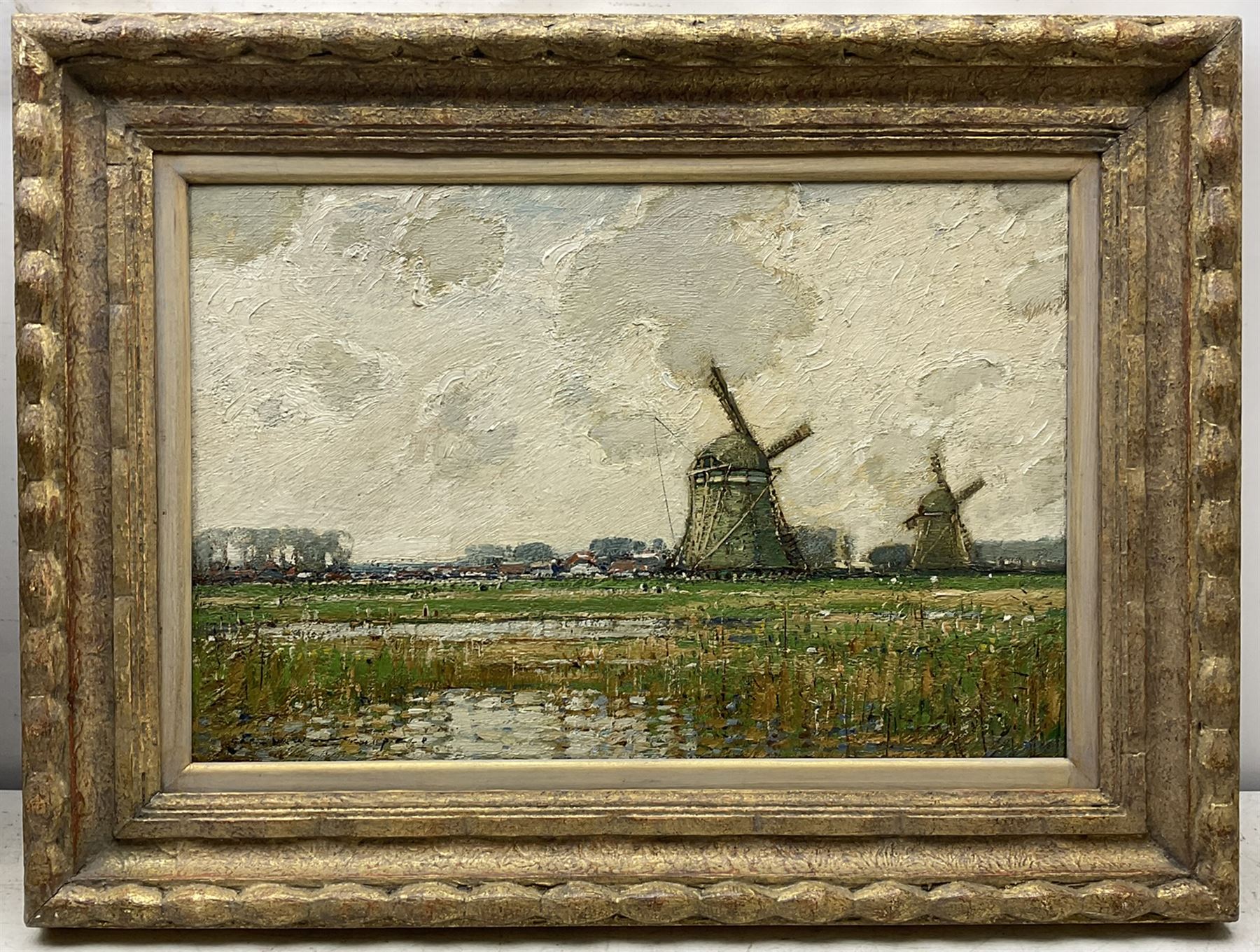 Kershaw Schofield (British 1872-1941): Dutch Landscape with Windmills beyond a Reedy Pond, oil on panel signed 34cm x 51cm