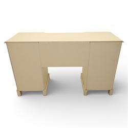 Contemporary French design white painted bedroom suite retailed by Barkers of Northallerton, comprising wide chest fitted with four short and four long drawers with oval brass handles (H 70cm, W 159cm, D 46cm), pair of bedside chests each fitted with three drawers (H 62cm, W 40cm, D 46cm), dressing table fitted with four short drawers and central kneehole with shaped apron (H 79cm, W 131cm, D 46cm) with matching framed wall mounted mirror (H 100cm, W 113cm), and full length standing mirror (H 175cm, W 73cm)