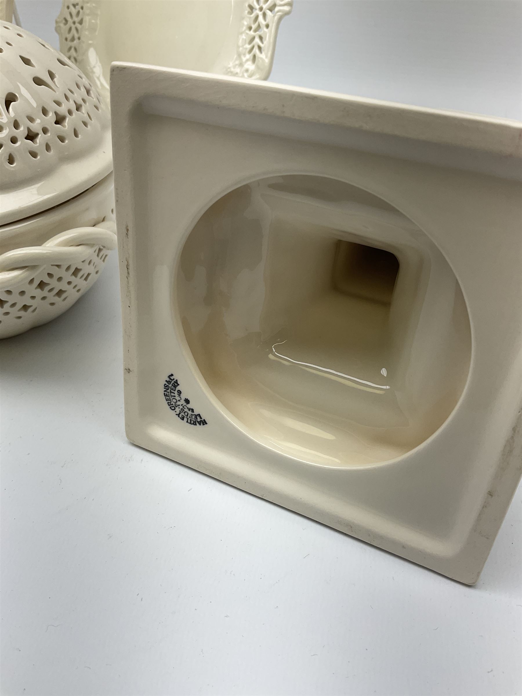 Collection of Harley Greens & co Leeds pottery creamware, including two candle sticks H14.5cm, two twin handled bowls, three plates, square tray and lidded bowl. 