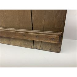 George III oak spoon rack and candle box, the rectangular backplate with shaped  pediment and two six aperture spoon racks, above a candlebox with hinged cover, with various brass spoons and a pair of brass candle snuffers, H56.5cm, W35cm, D14cm 