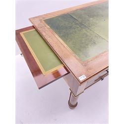 French Empire style walnut desk, moulded rectangular top with inset leather, two leather inset slides either side, fitted with four drawers, turned supports joined by curved x-shaped stretchers, gilt metal mounts 