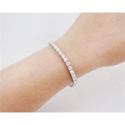 18ct white gold diamond bracelet, forty round brilliant cut diamonds , in a four claw setting, stamped 18K, total diamond weight 12.26 carat, with World Gemological Institute report