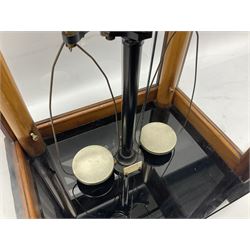 Set of laboratory balance scales by Reynolds & Branson of Leeds in fully glazed mahogany case with rise-and-fall front door, black vitrolite base with brass feet and hand cranked action L40cm H51.5cm D30cm; and bakelite cased set of brass weights