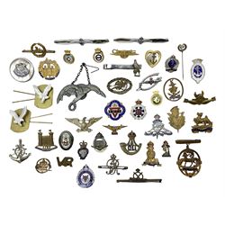 Over thirty military and sweetheart brooches/badges, including RASC, RA, RAFVR, RAF, RN, Durham Light Infantry, Essex Regt., Royal Berks, Highland Light Infantry, Knitted Garments for RN, The Queens etc; some with enamelled decoration