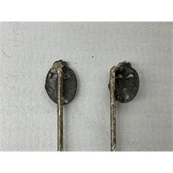 Nine WW2 German lapel pins including five Infantry Assault, Tank Assault etc 