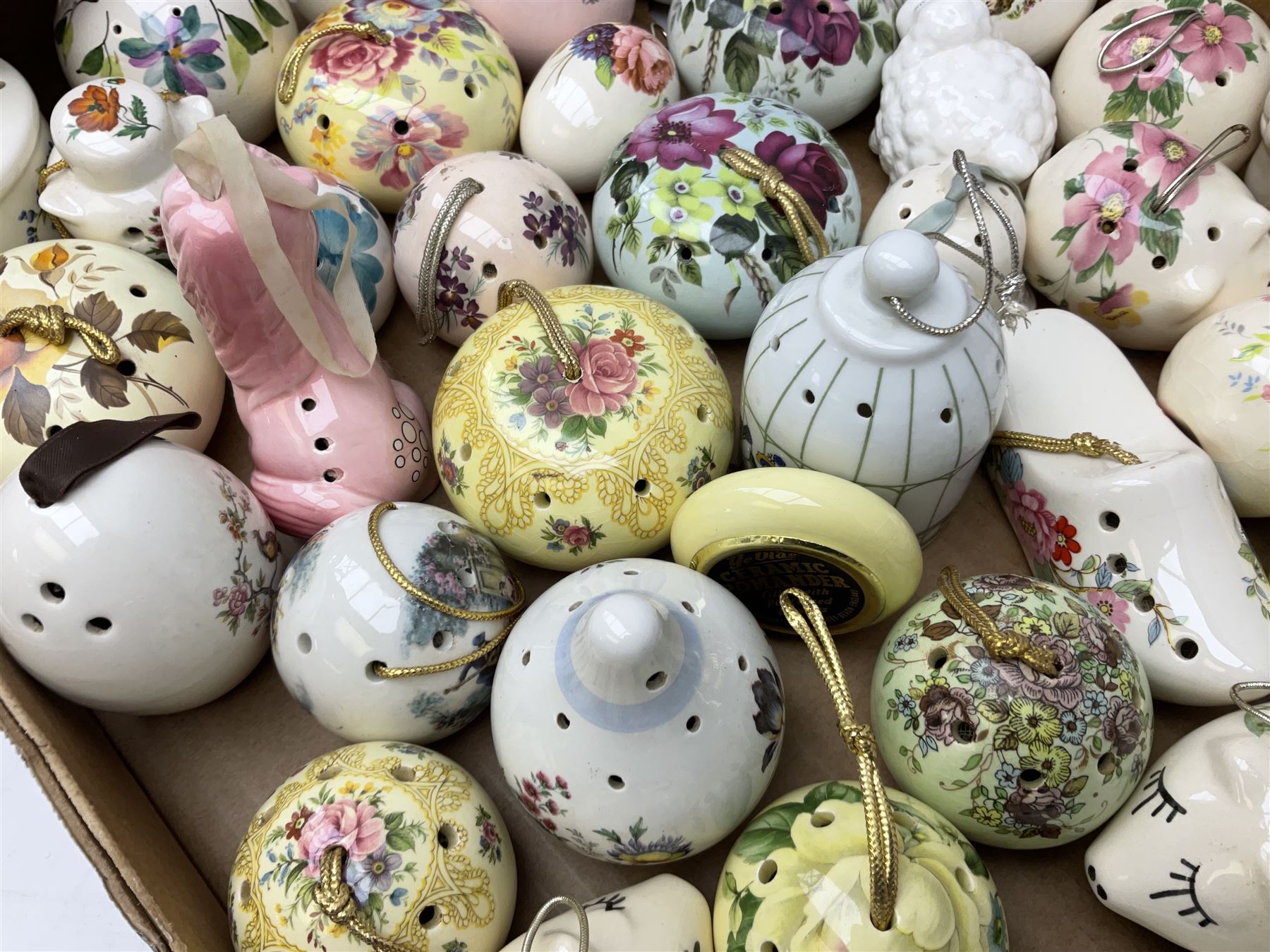 Large collection of ceramic pomanders, to include examples modelled as animals, floral examples etc