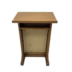 20th century ecclesiastical oak lectern, the sloped rest on moulded end supports with carved decoration, the front panelled with Gothic style carved and pierced tracery, on sledge feet