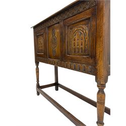 17th century style caved oak side cabinet, fitted with two cupboards, stretcher base