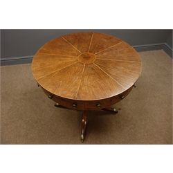  Early 19th century rosewood and inlaid drum table, eight segment veneered top, four false and four working drawers, turned column, splayed supports with brass cups and castors, D79cm, H74cm   