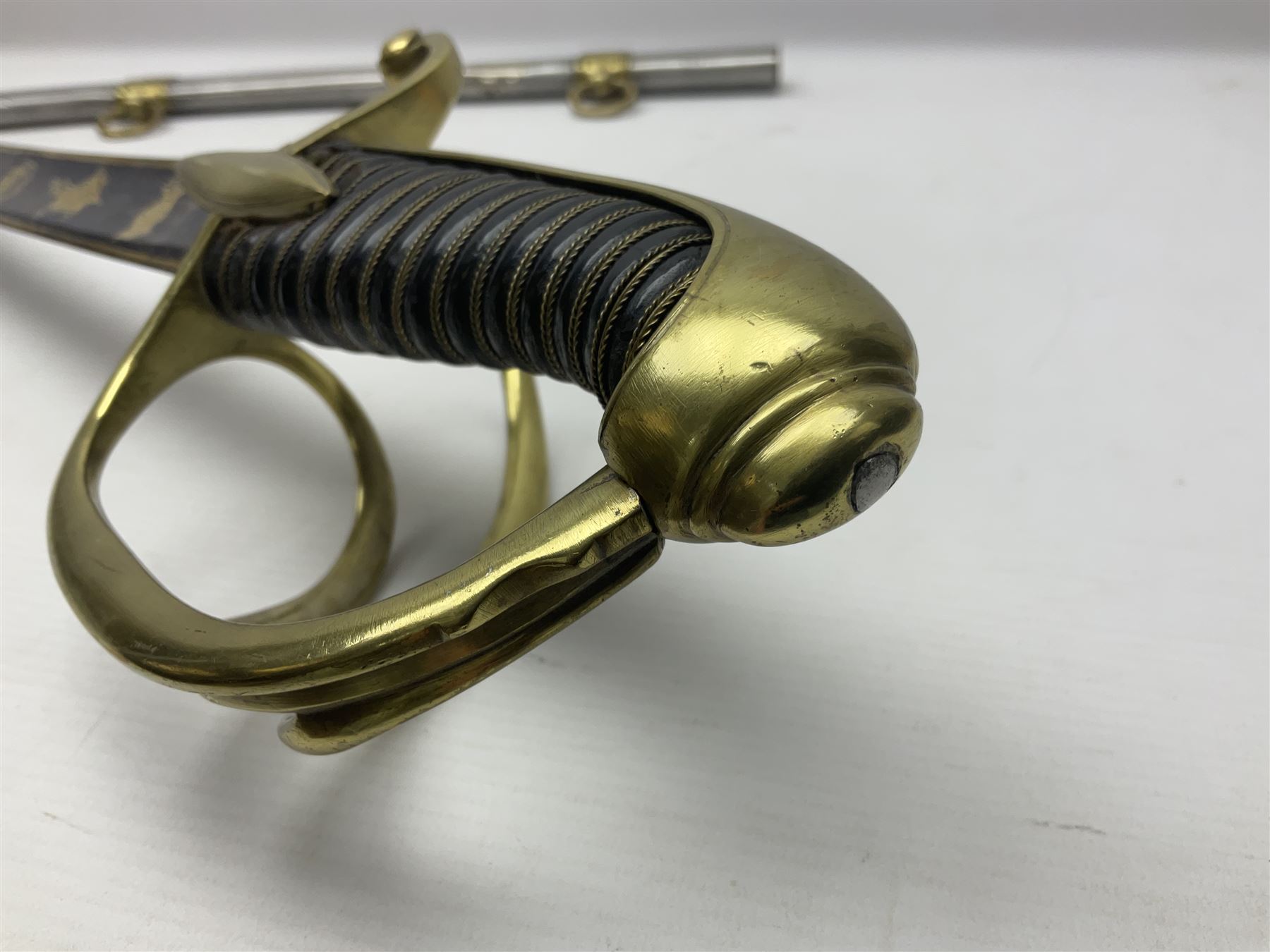 Early 19th century French Lancers officer's sword c1810, the 84cm curving fullered blade retaining most of its bluing, gilding and engraved decoration, inscribed I.S.& C. to ricasso (for Schimelbusch), brass three-bar hilt with elongated elliptical langets and wire-bound leather grip; in polished steel scabbard with two brass suspension rings L100cm overall
