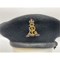 WW2 British black felt beret with Pioneer Corps cap badge, with Kangol Wear maker's mark dated 1943; and a British Army green webbing belt (2)