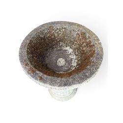 Four 20th century good quality weathered cast stone pedestal urns, circular lobed bowls with rope twist and lattice border, raised on squat base with fluted columns