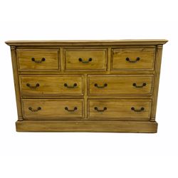 Polished pine chest, fitted with seven drawers