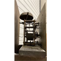 8-day oak longcase clock - in an early 18th century styled case with a caddy top, square hood door with barley twist columns, long carved trunk door on a conforming plinth with an applied skirting base, square brass dial with an engraved centre, silvered chapter and spandrels, 19th century rack striking movement, striking the hours on a bell. With weights and pendulum.