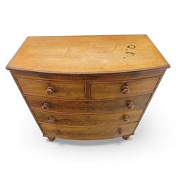 19th century mahogany bow-front chest, with two short over three long graduated drawers, fitted with turned wooden knobs, raised on turned bun feet