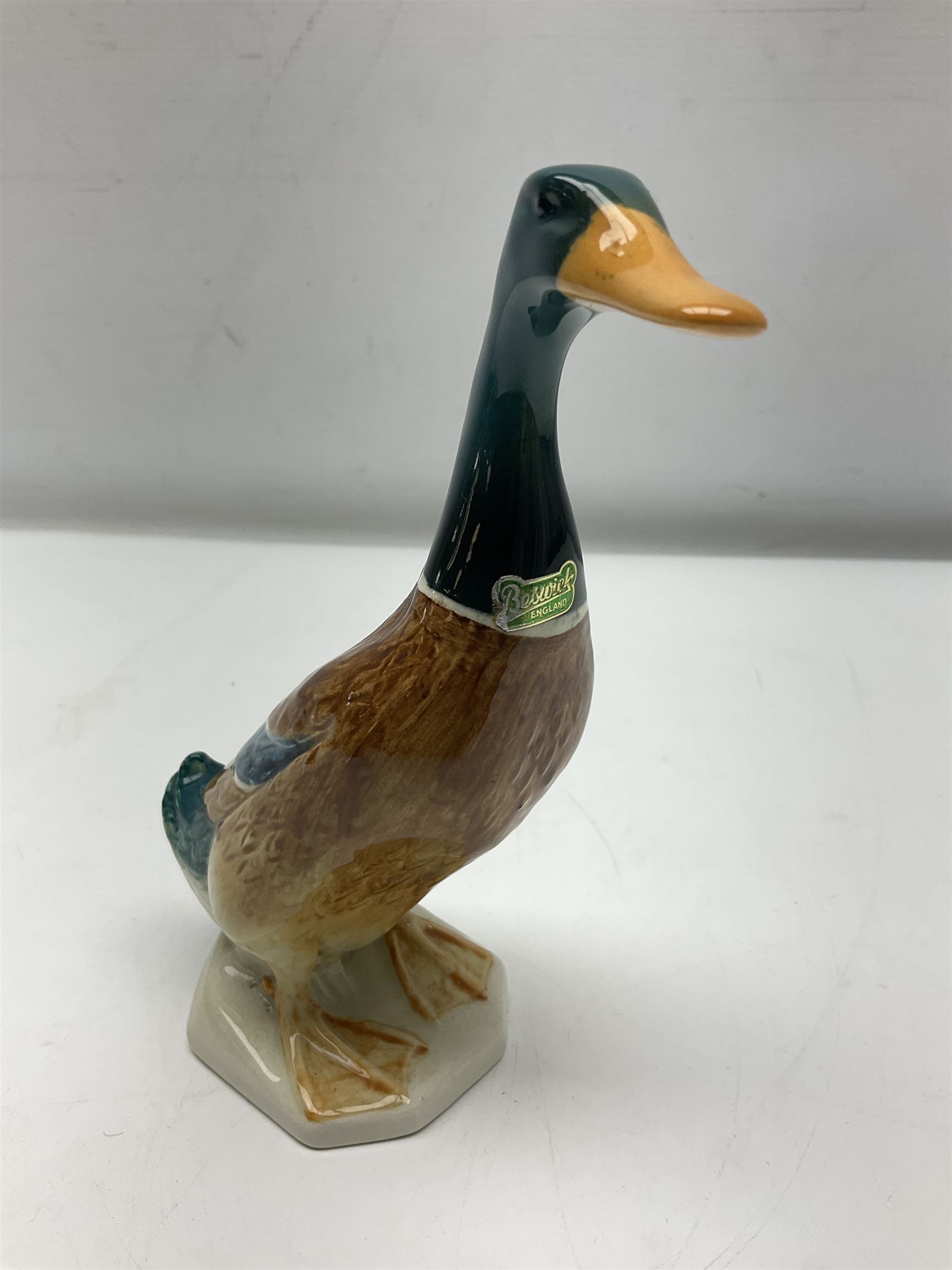 Beswick Champion of Champions Hereford bull figure no 1360, Beswick Norman Thelwell An Angel on Horseback no 2704A, and three other Beswick figures to include Arab Bay horse, Mallard and Comical Duck Family, all with printed or impressed marks beneath, largest H17.5cm