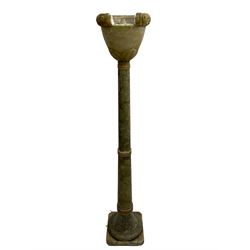 Early to mid-20th century green and black gradient alabaster uplighter standard lamp, the shade with flower head decorated rim and foliage decoration to the underbelly, on collar turned tapered stem terminating to splayed moulded foot, square base