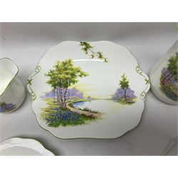 Aynsley Bluebell Time 'As Supplied to the Queen' tea service, comprising hot water jug, six teacups and saucers, milk jug, two cake plates and tow trinket dishes  