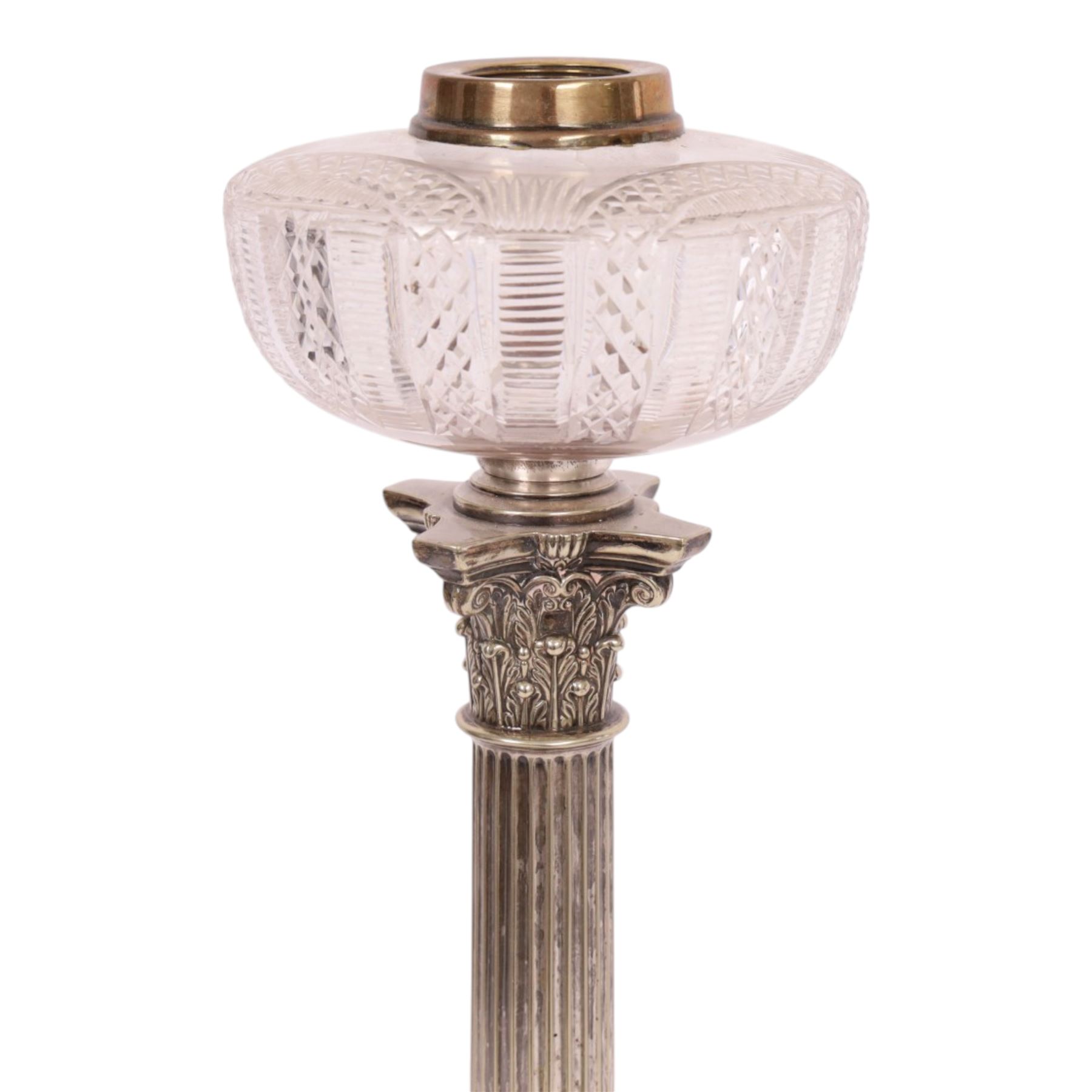 Victorian silver plated Corinthian column oil lamp, raised upon a stepped base, clear glass reservoir, H54cm 