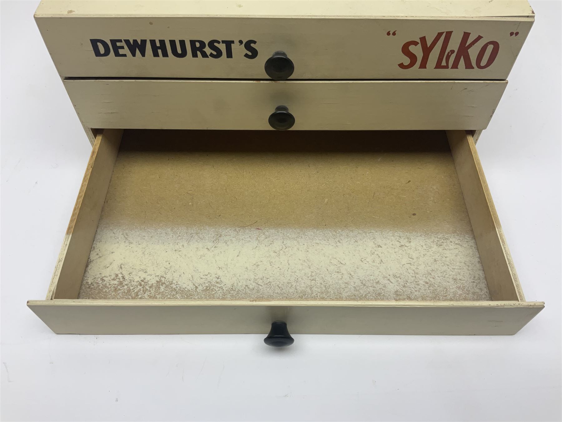 Mid 20th century Dewhurst's 'Sylko' advertising counter top three drawer chest, H14.5cm